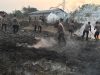 Gerak Cepat, Satuan Brimob Polda Lampung Tangani Kebakaran Lahan Warga di Bandar Lampung
